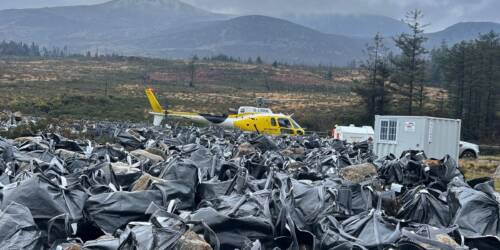 Helicopter with bagged stone